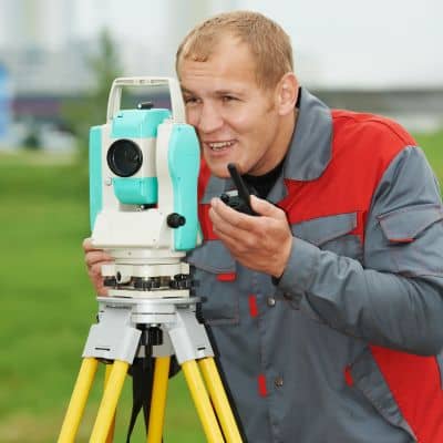 Licensed surveyor verifying measurements to support accurate drone land surveying