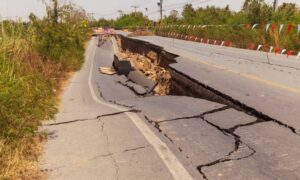 A collapsed roadway showing severe ground movement, illustrating why a topo survey is important for detecting terrain instability