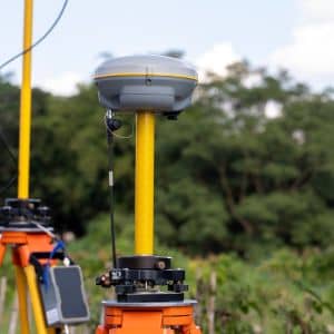 GPS equipment collecting topographic survey data on site
