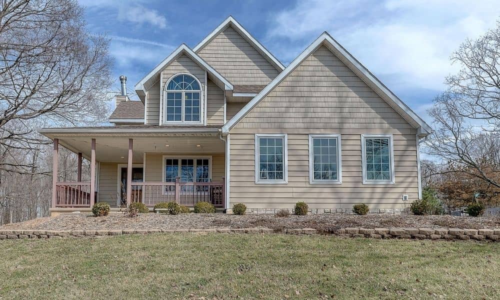 Residential home with open yard space where a perc test can help assess the feasibility of a second dwelling and septic system