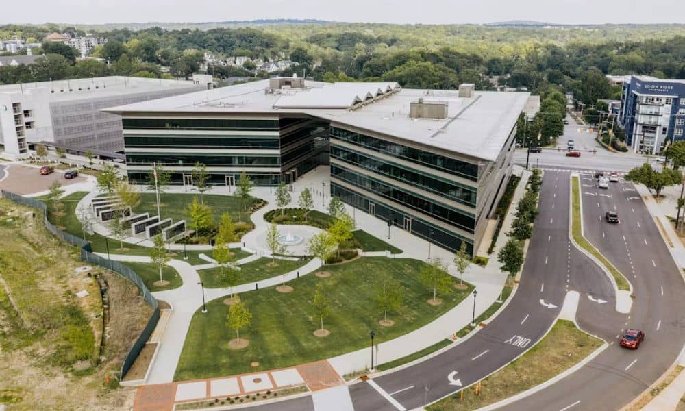 Aerial view of a modern commercial property where an ALTA survey may be required when ownership changes